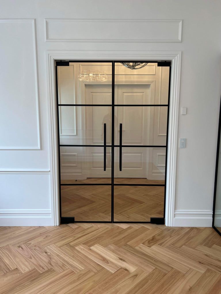 Elegance in Motion: The Allure of Internal Glass Doors as Stylish Room Dividers